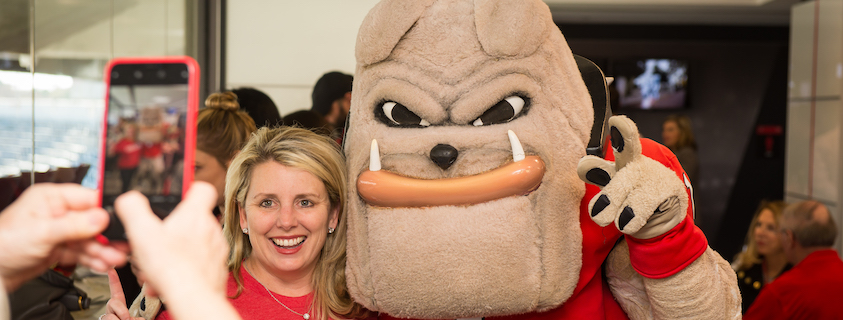Alumna with Hairy Dawg at Alumni Weekend
